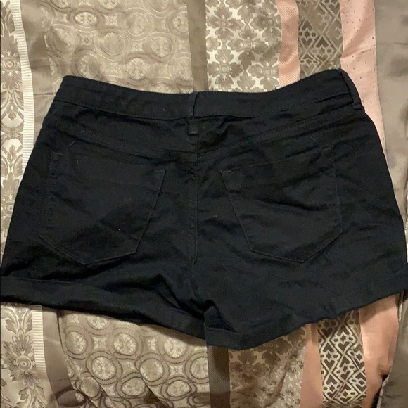 A mid-rise midi black pair of shorts. - Picture 2 of 2